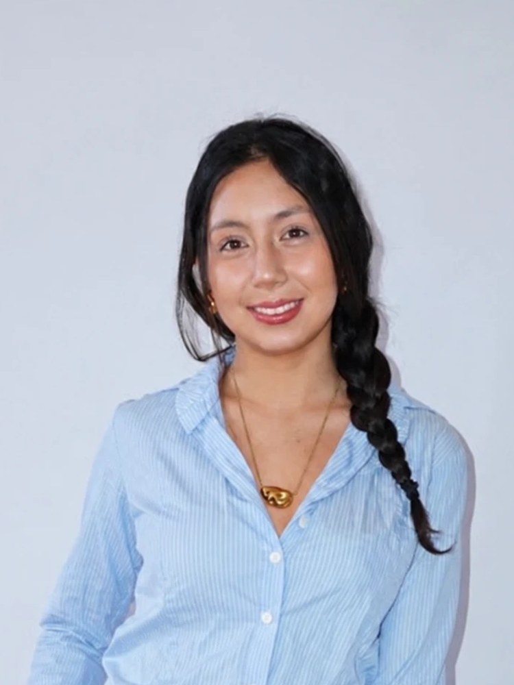 Ashley Geohas, founder of After, smiling in a light blue shirt